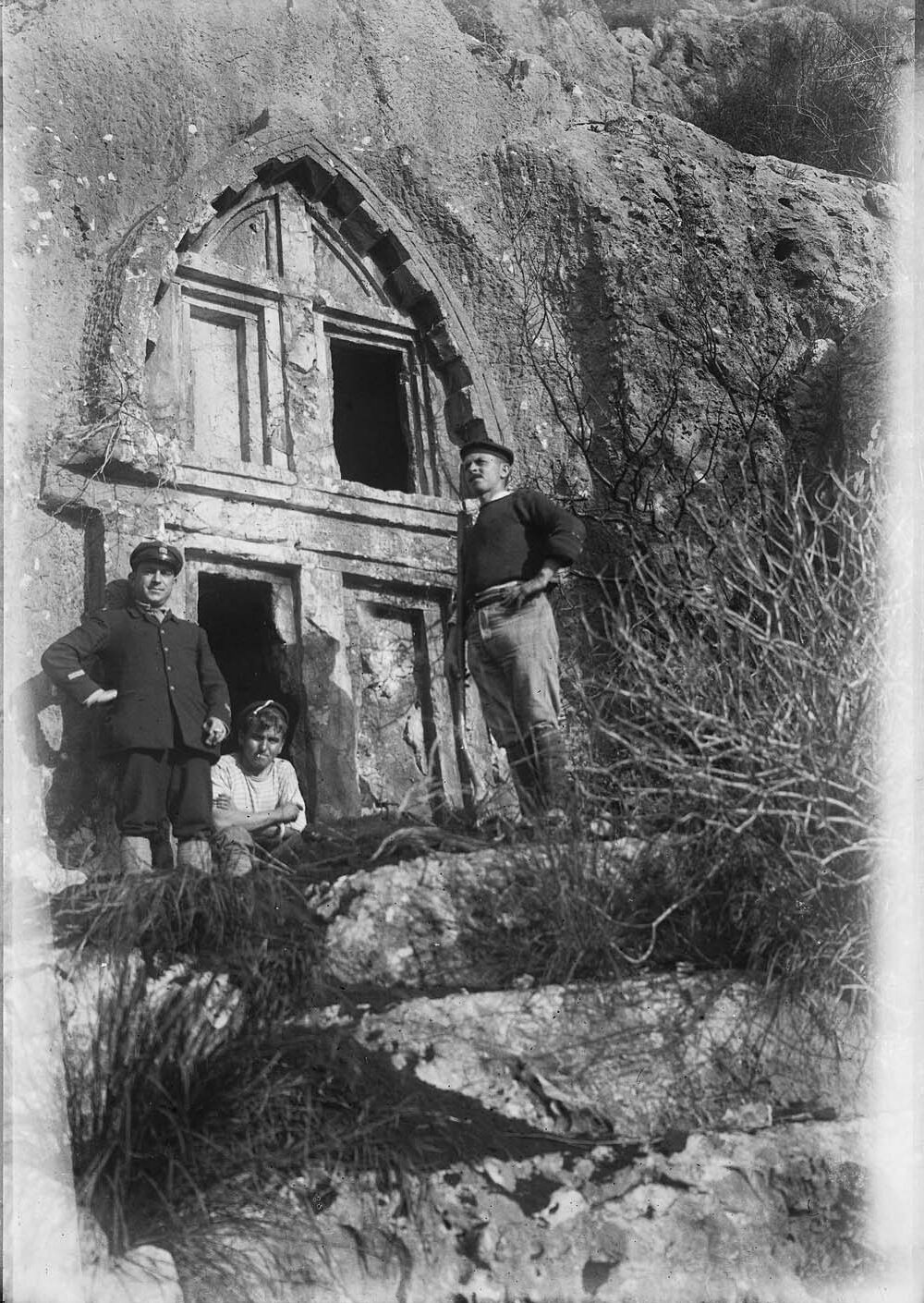 Three People Behind Antiphellos Rock Tomb