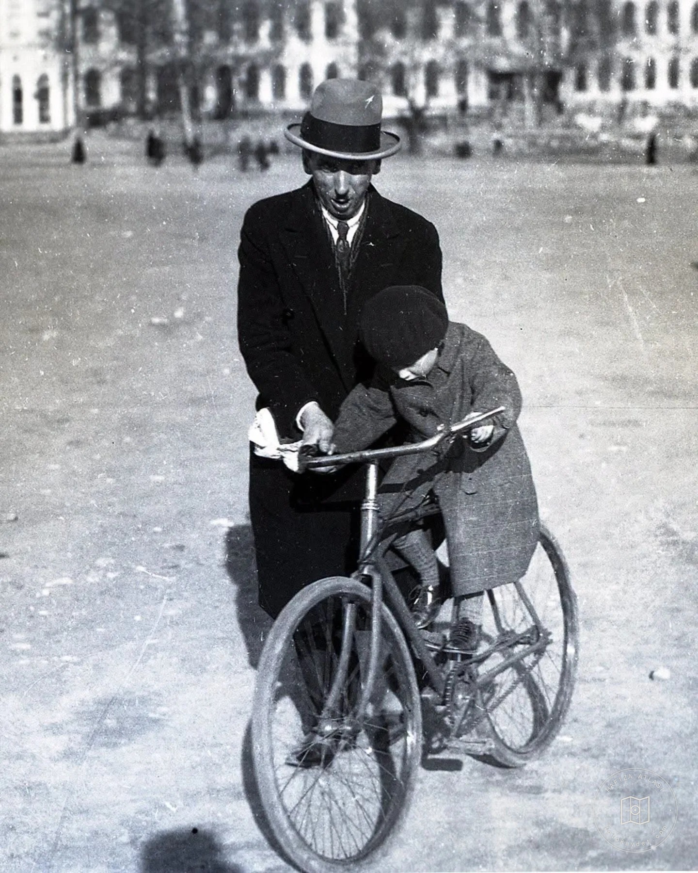 A child on a bicycle and his father in Talimhane, 23 April 1929