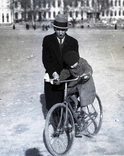 A child on a bicycle and his father in Talimhane, 23 April 1929