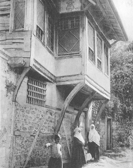 A wooden house displaying a “Maşallah” sign