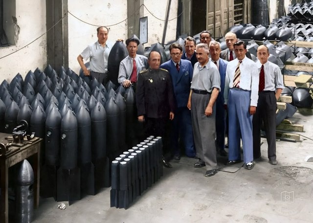 Nuri Killigil and engineers standing beside aircraft bombs