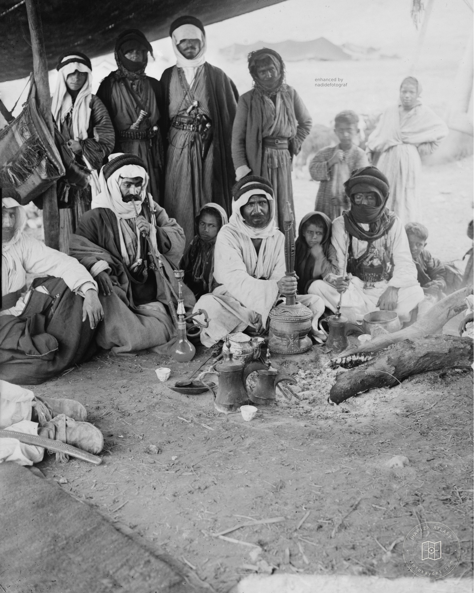 A Bedouin family preparing coffee in Palestine, 1900