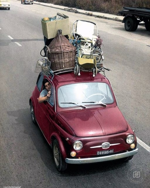 A family traveling on holiday in a Fiat 500 in Italy, 1967