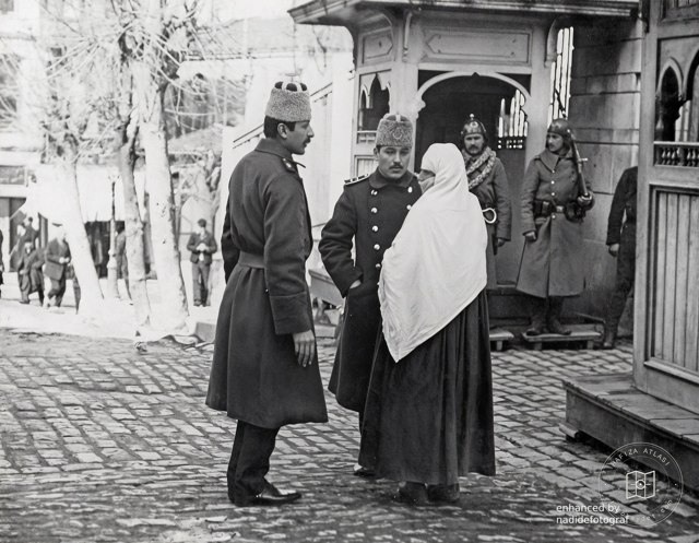 A soldier's wife speaking with officers, 1913