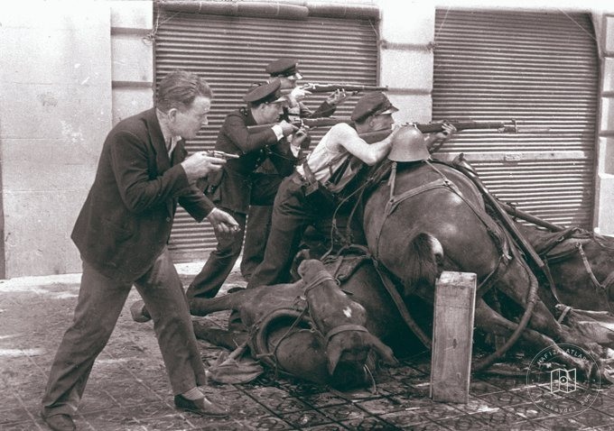 Soldiers behind a barricade in Barcelona, 1936