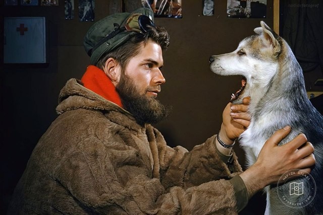 Examining a dog near the South Pole, 1957