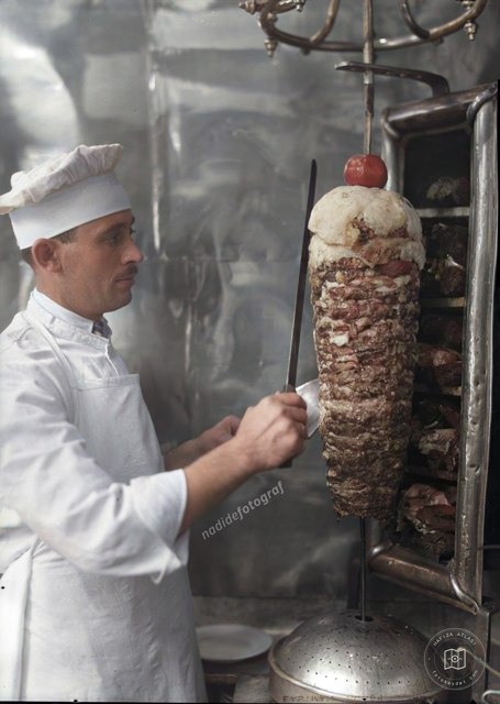 A cook carving döner