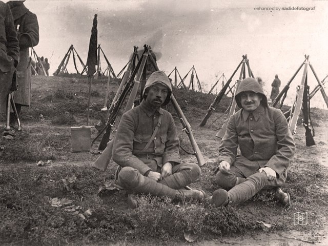 Soldiers resting on a battlefield
