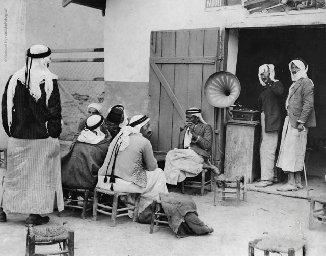 People listening to a gramophone in a Jerusalem coffeehouse, 1938