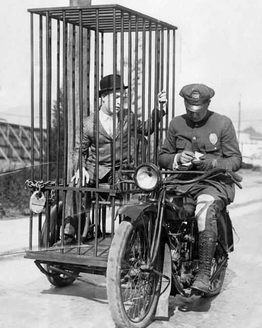 A police officer transporting a prisoner by motorcycle in Los Angeles, 1924