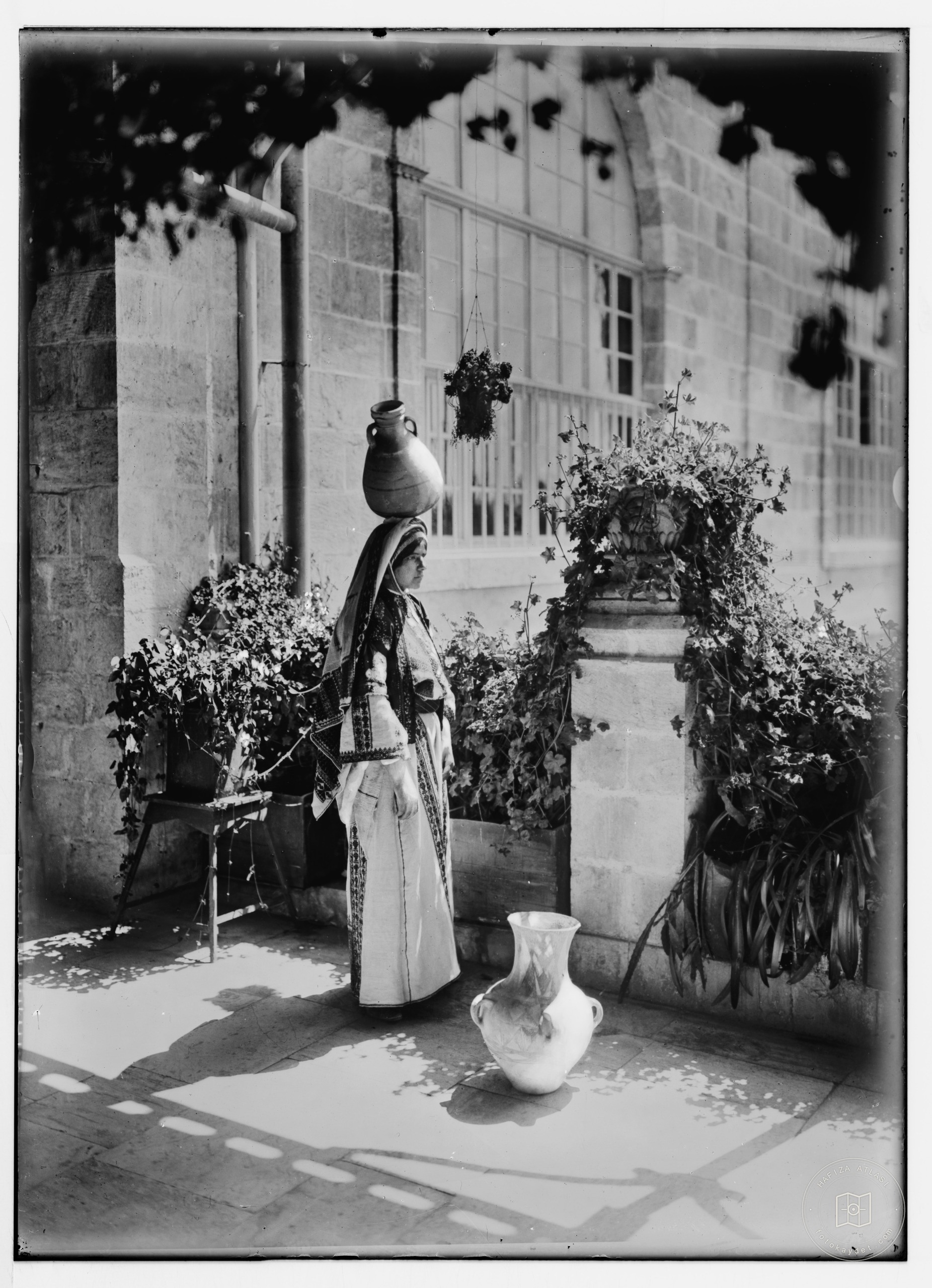 Woman from Ramallah carrying a water vessel, Jerusalem