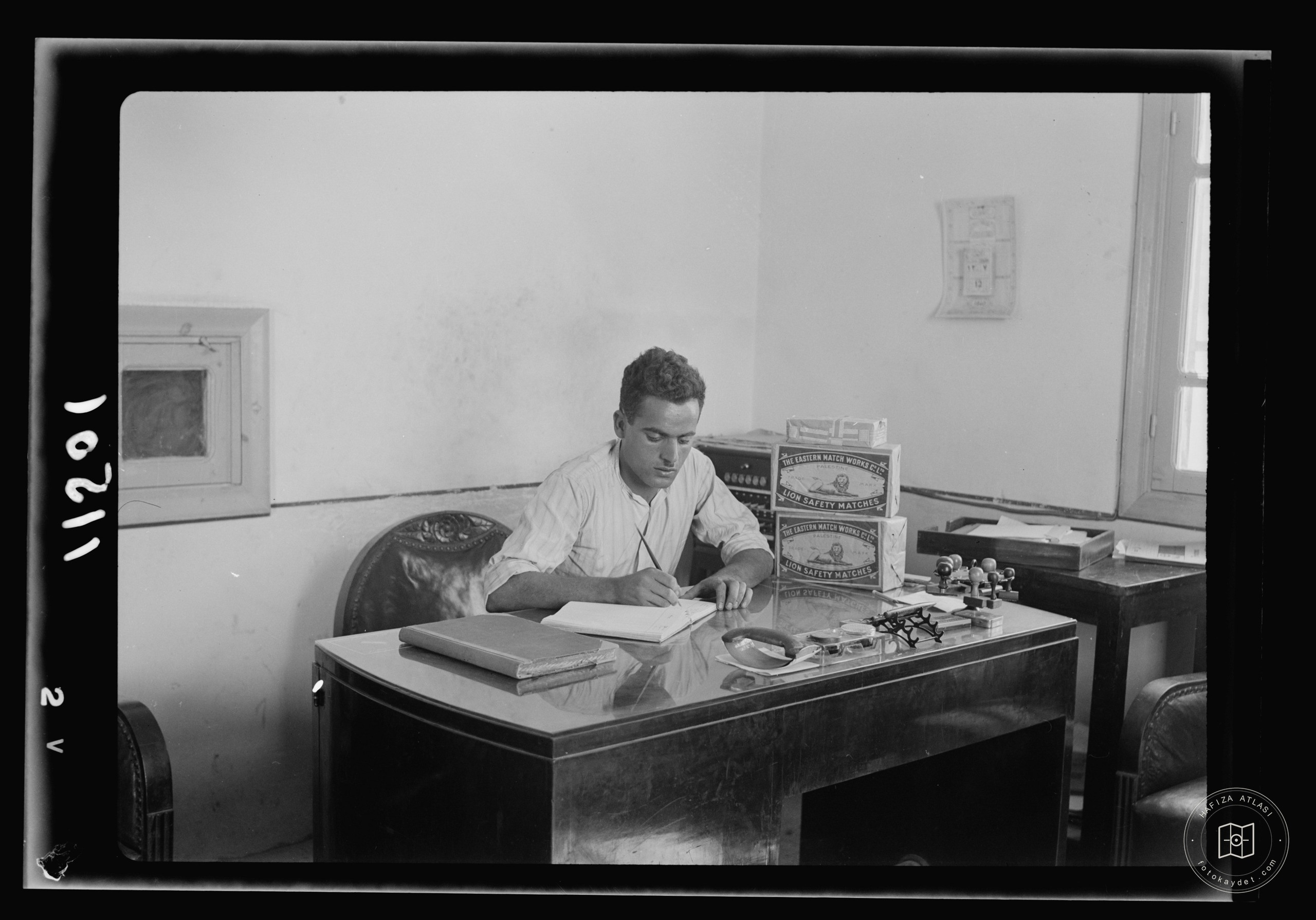 Man at a factory office desk, Nablus