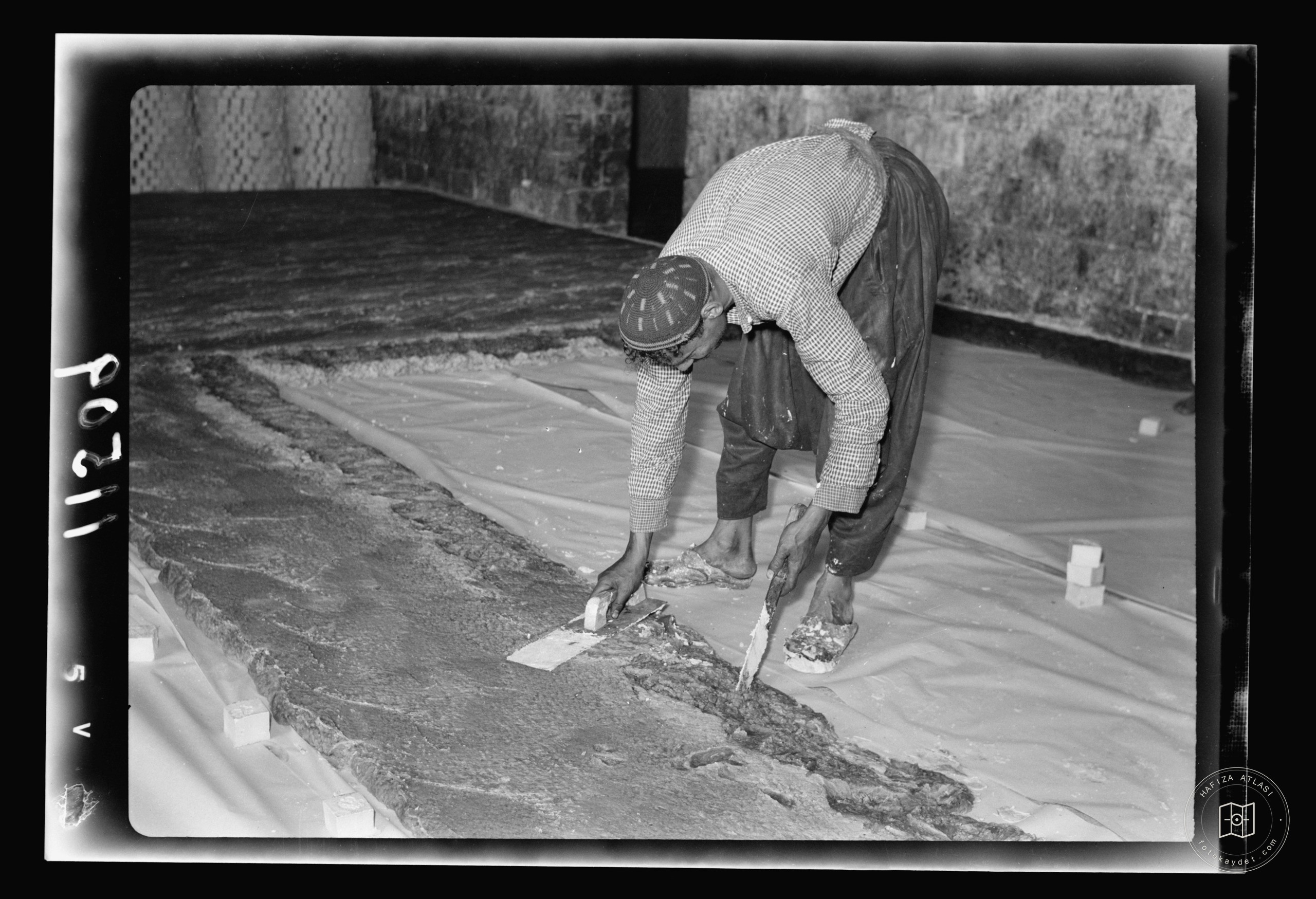 The Soap Factory. Soap being flattened before becoming quite hard, Nablus