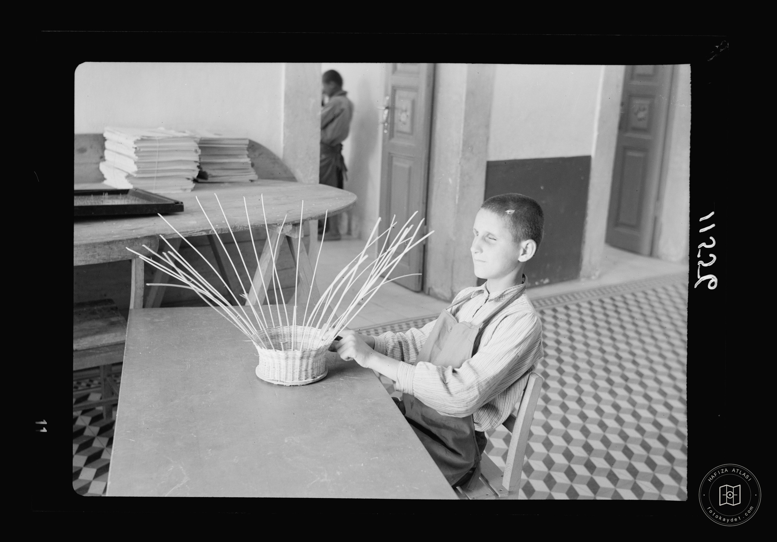 Blind school in Hebron. Close up of boy doing basket work