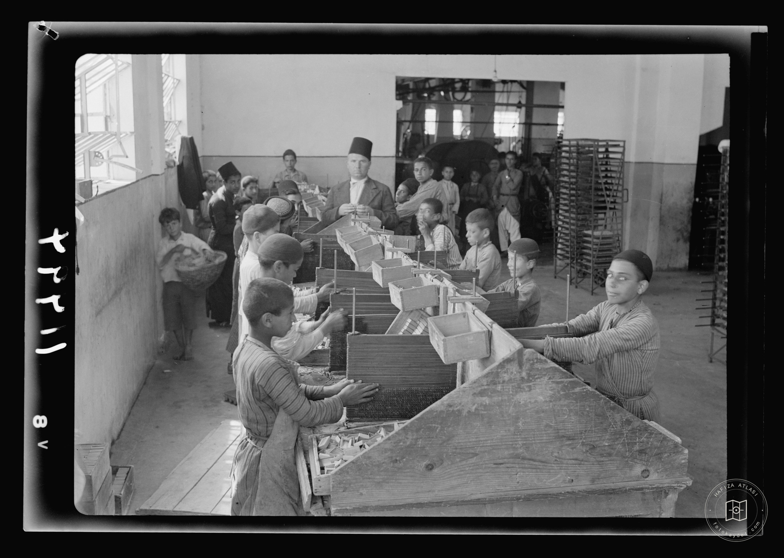 Match factory. Boys at work on match boxes, Nablus