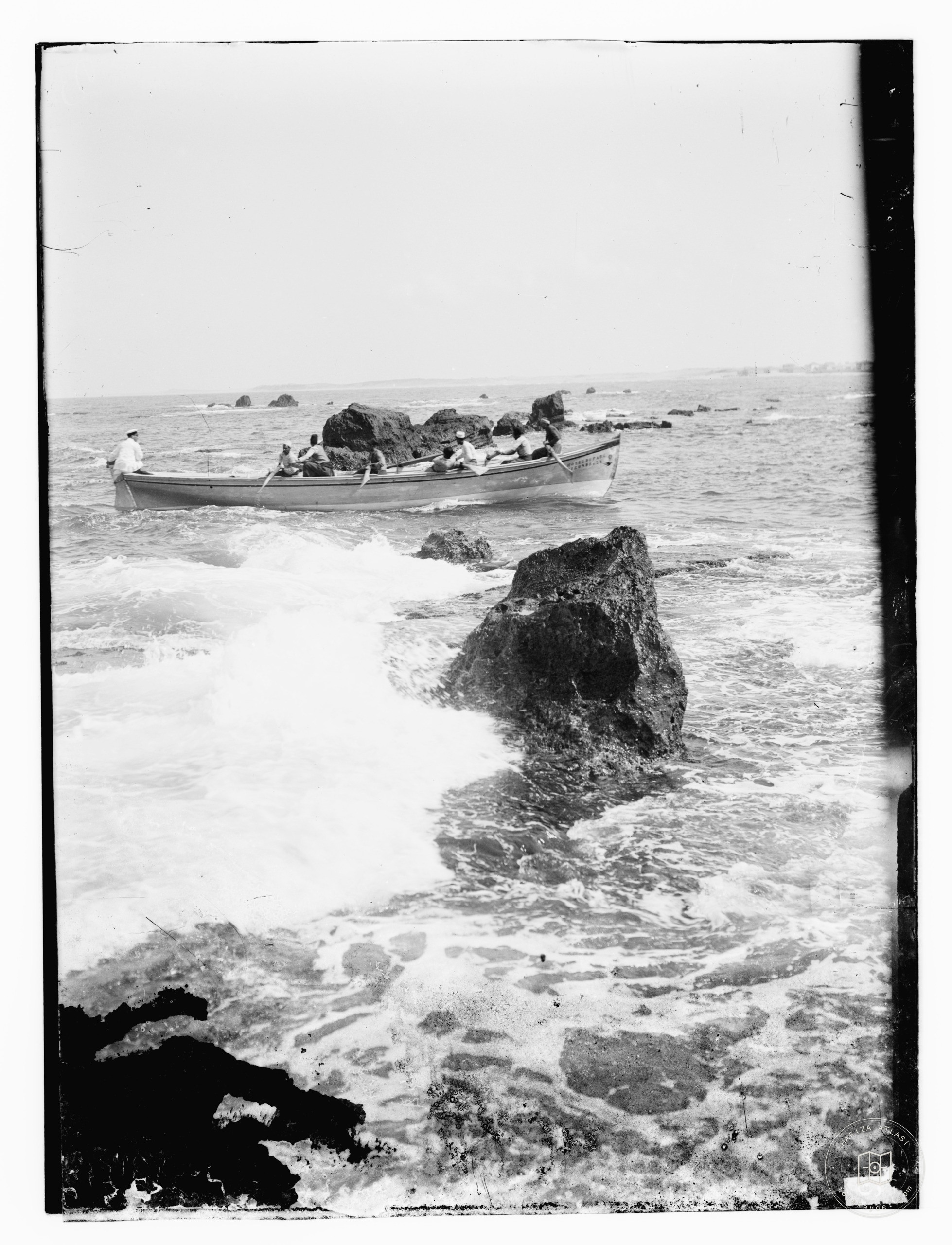 Boat passing rocks at Jaffa