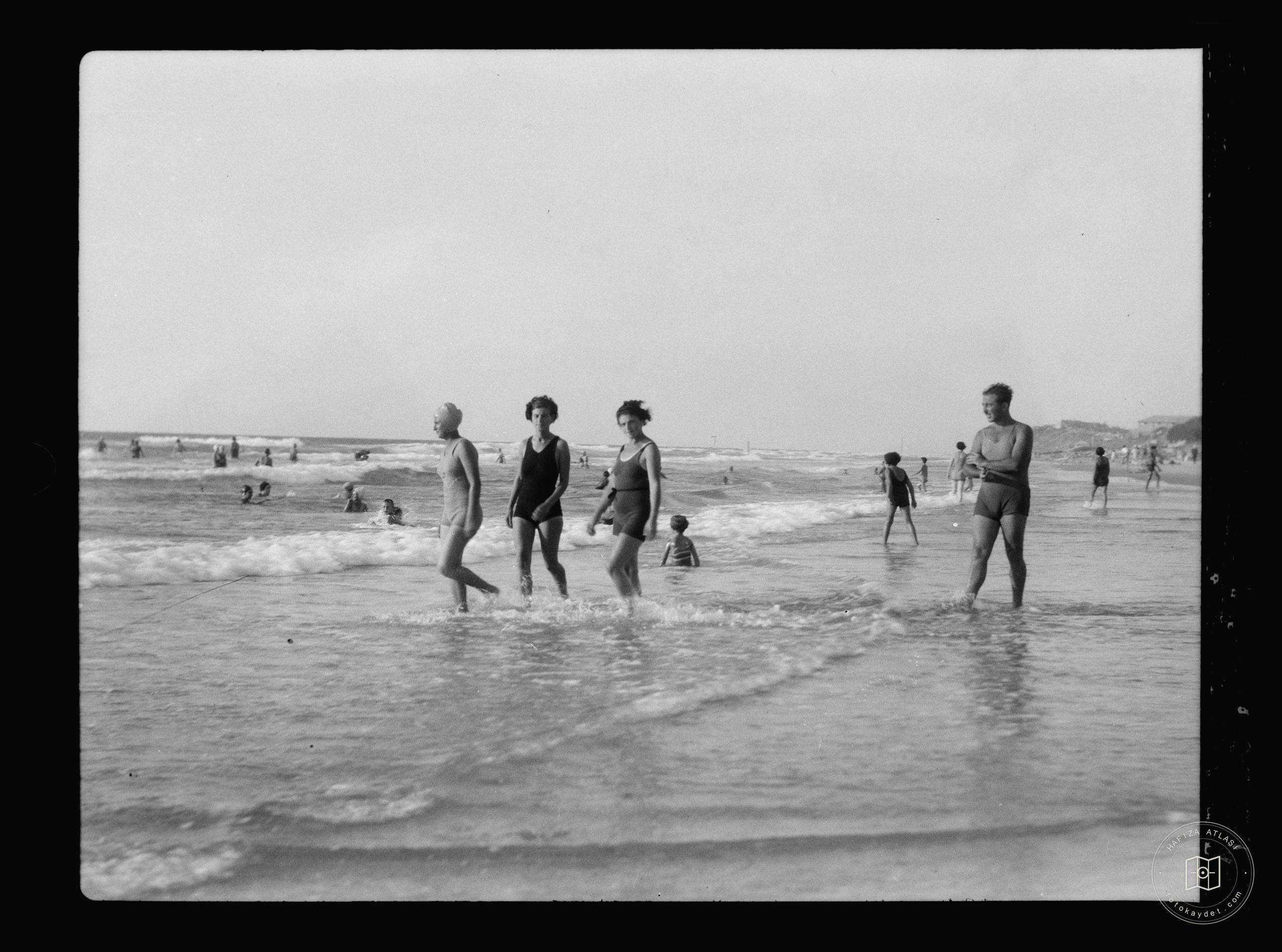 People walking in the shallows, Jaffa