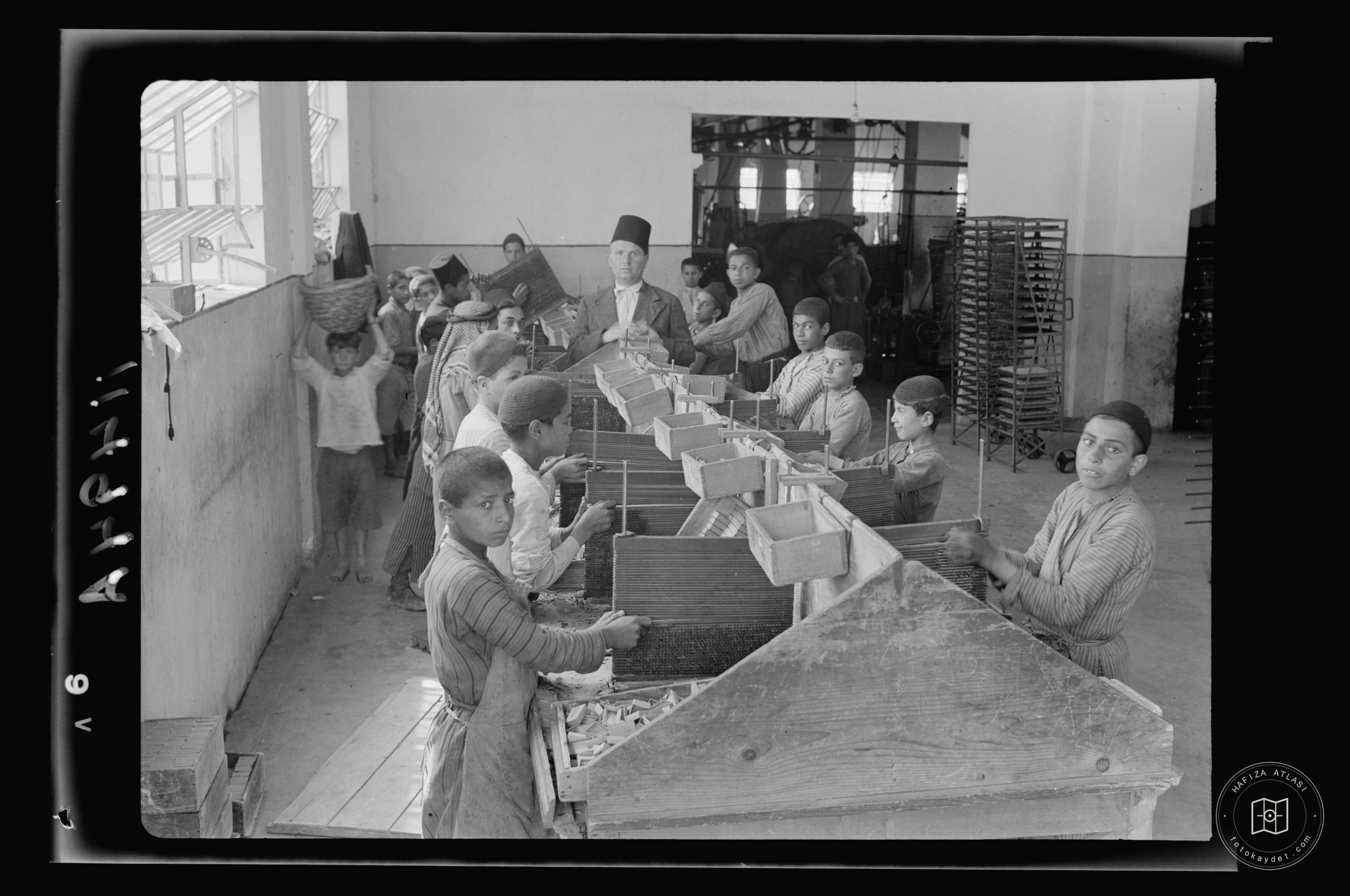 Match factory. Boys at work on match boxes, Nablus