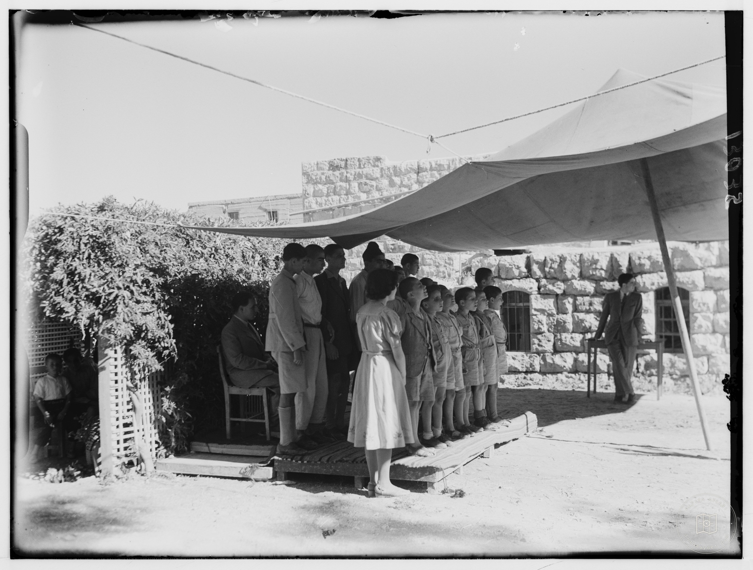 Hebron blind school commencement exercises. Group of blind boys singing