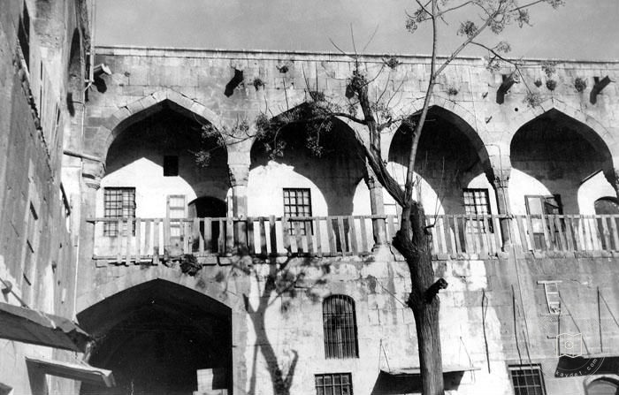 Aleppo — Wazir Caravanserai — courtyard balcony detail