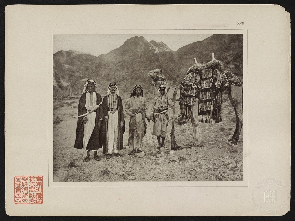 An ornamented riding camel and people in Mecca