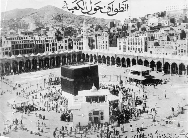 Circumambulation of the Kaaba with Mecca’s houses in the background