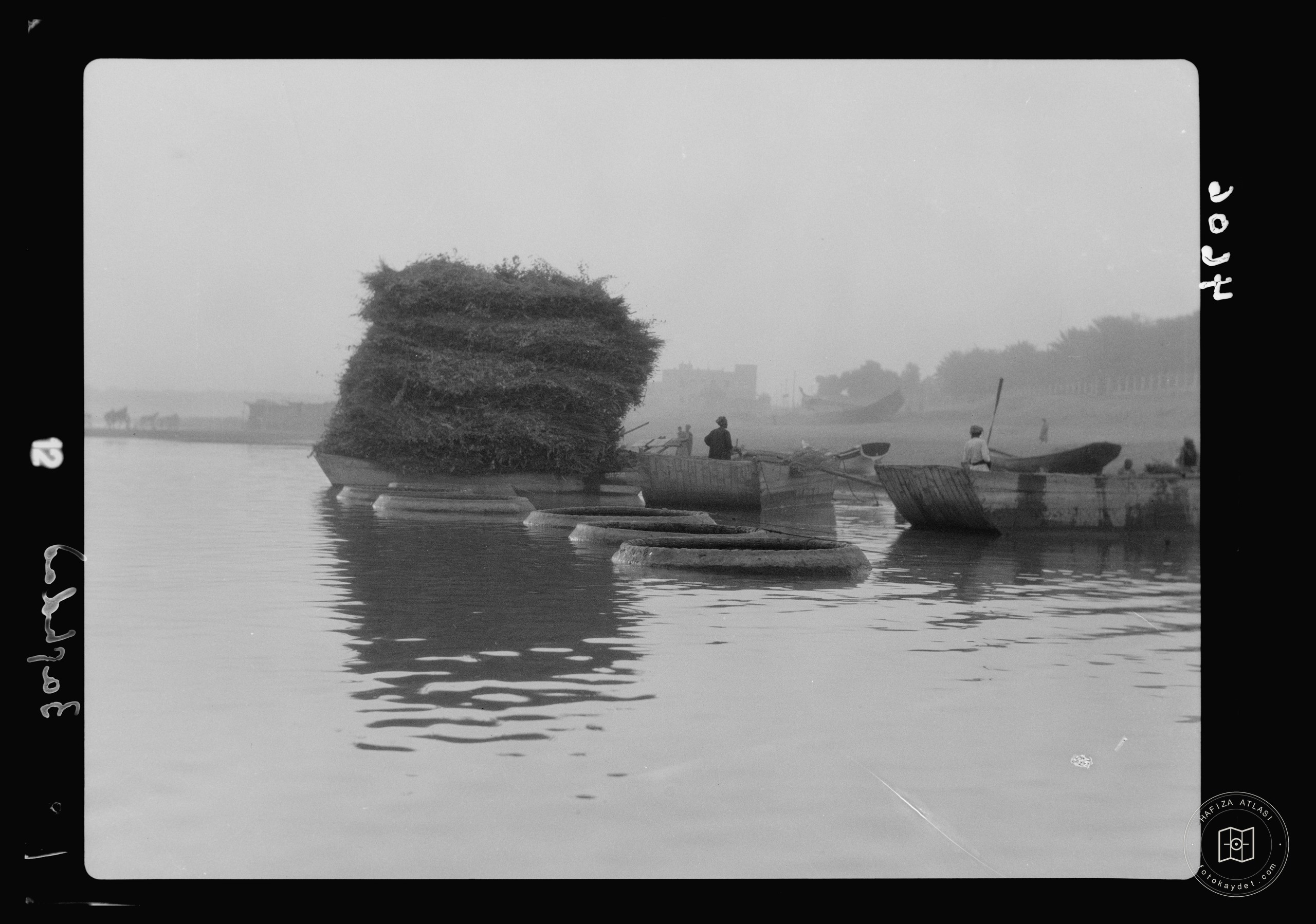 Baghdad. The Tigris. Ghuffas and fuel barges along the river banks