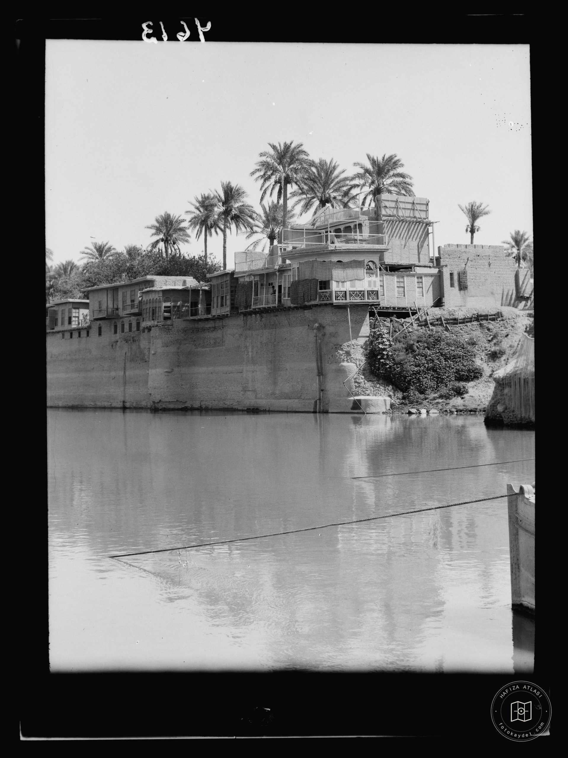 Baghdad. The Tigris. Dwellings on river wall. Raised well above river's high water mark on E. bank