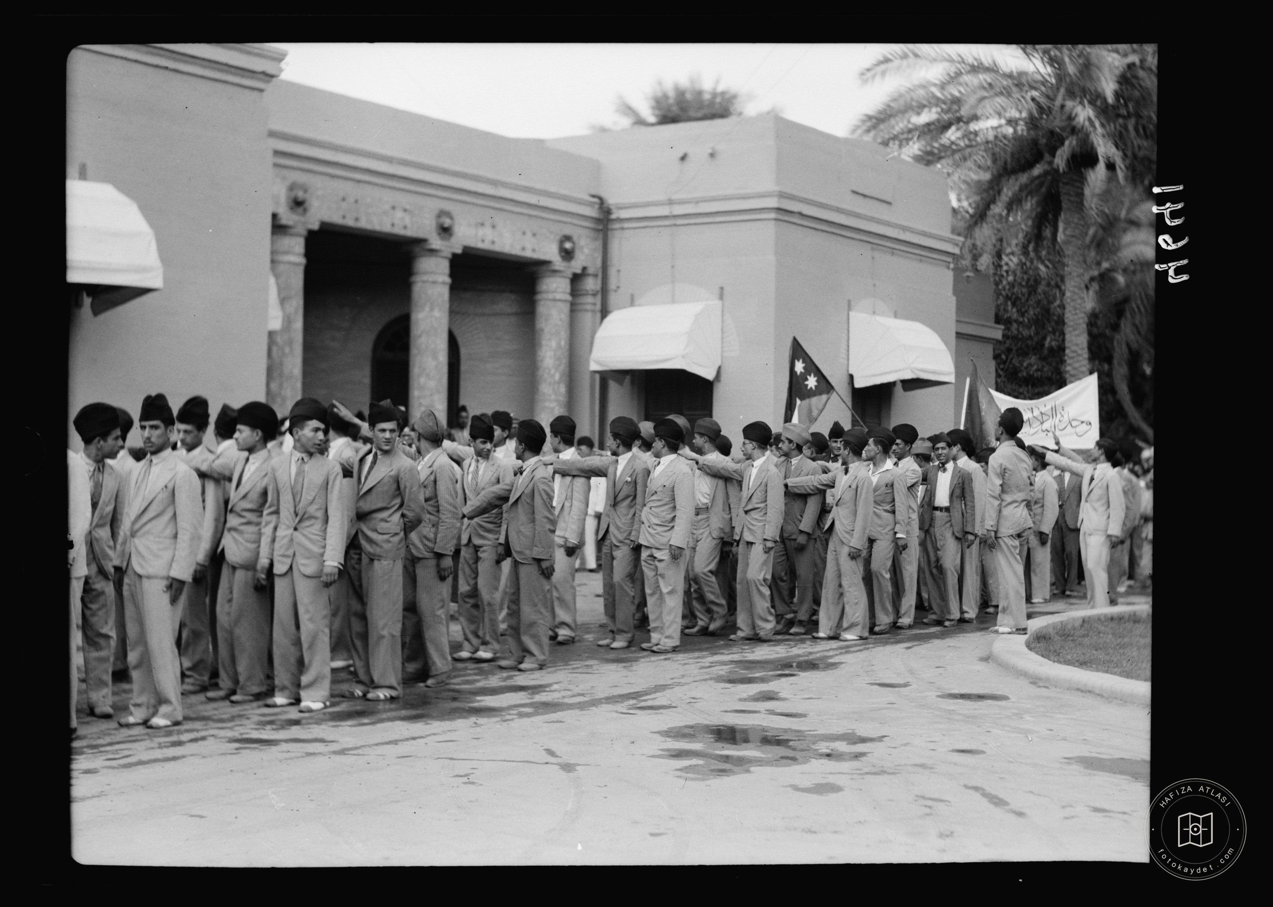 Celebration of Iraq becoming member of the League of Nations, Oct. 6, 1932. Baghdad. Young Iraqis offer the fascist salute. To. H.M. the King