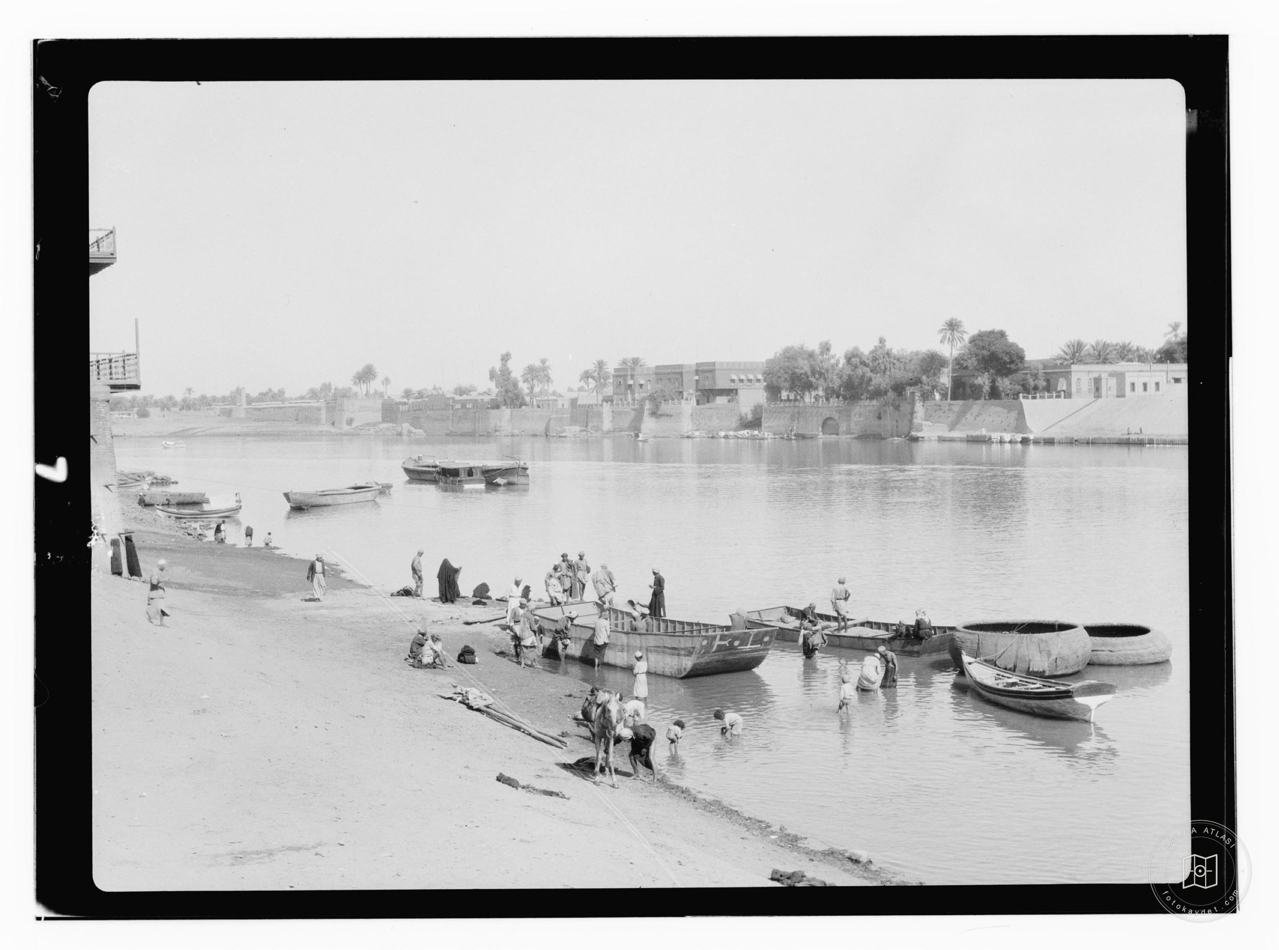 river scene & wall of city