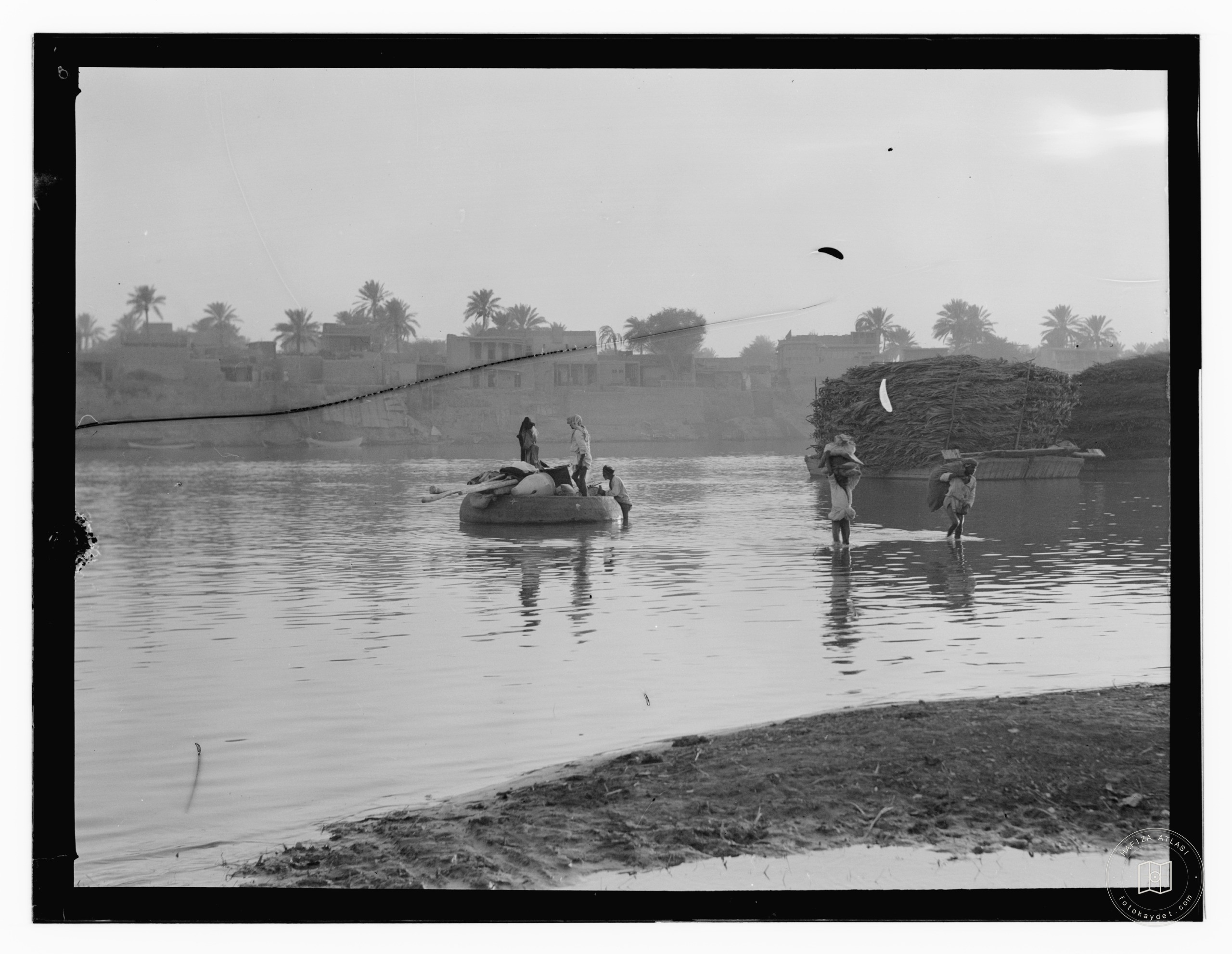 men in boat on river