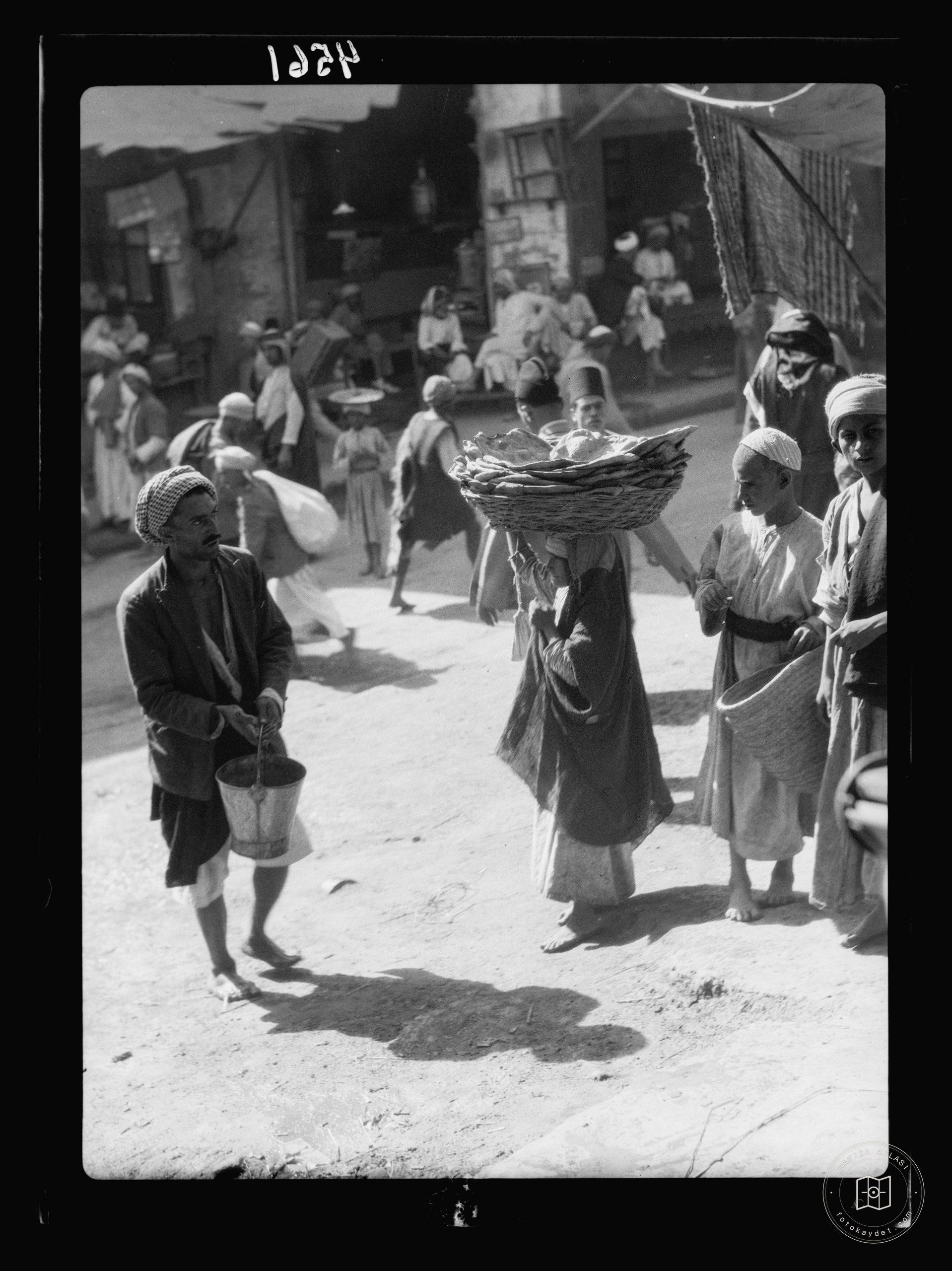 Baghdad. Girl selling bread in the bazaars