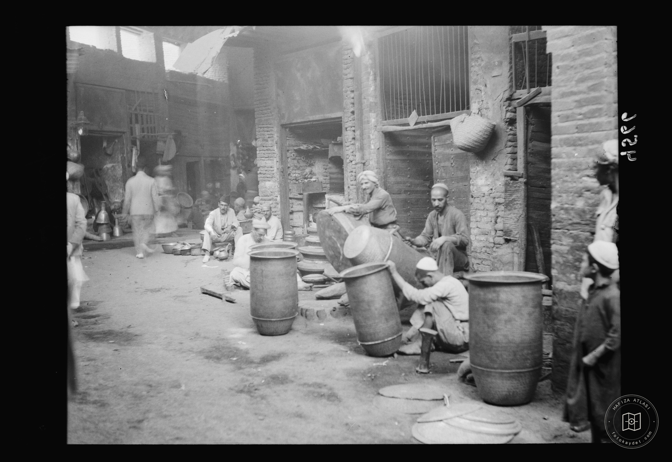 Baghdad. Copper workers. Hammering out large copper utensils