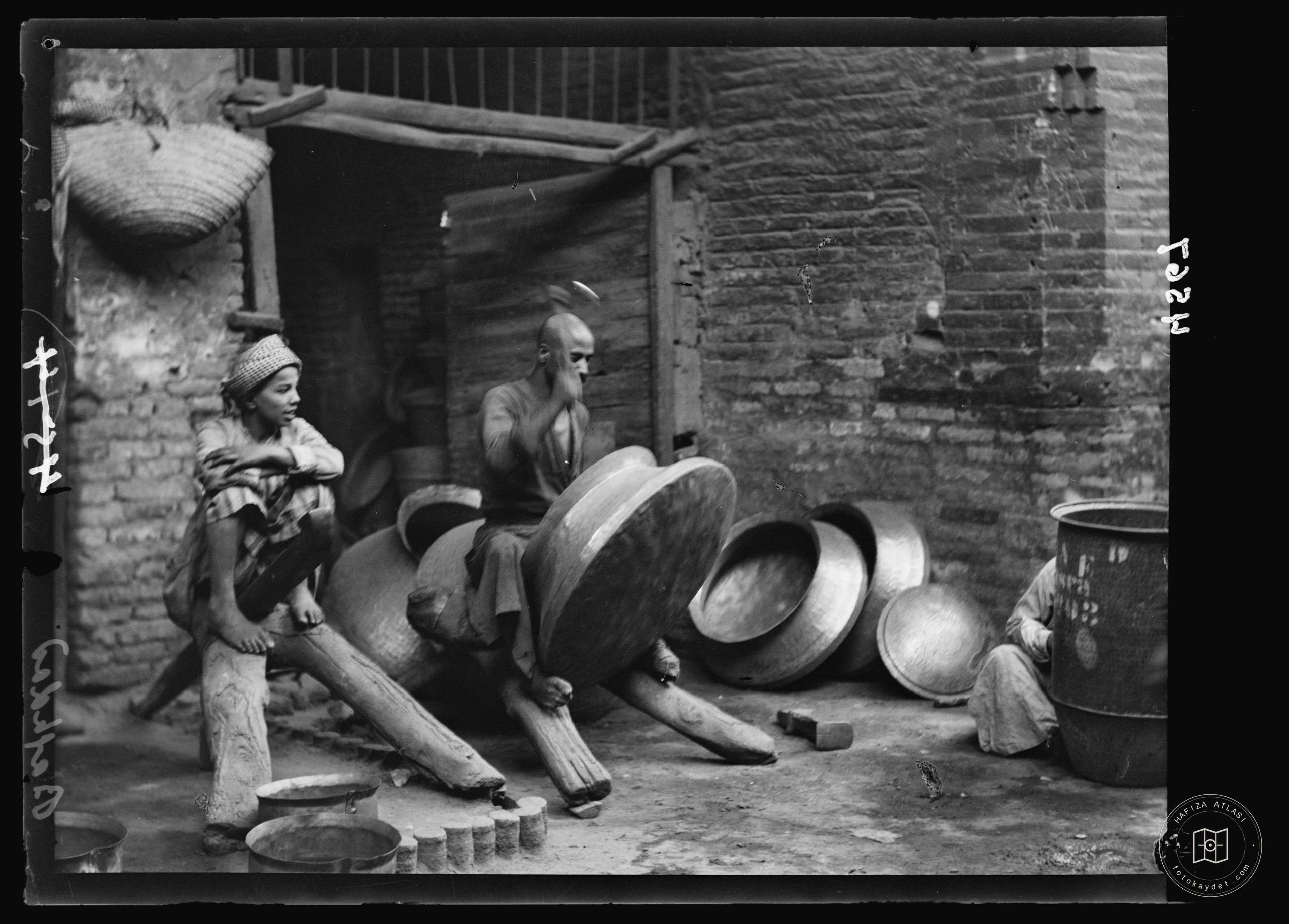 Baghdad. Copper workers with traditional wooden horses on which the work is done