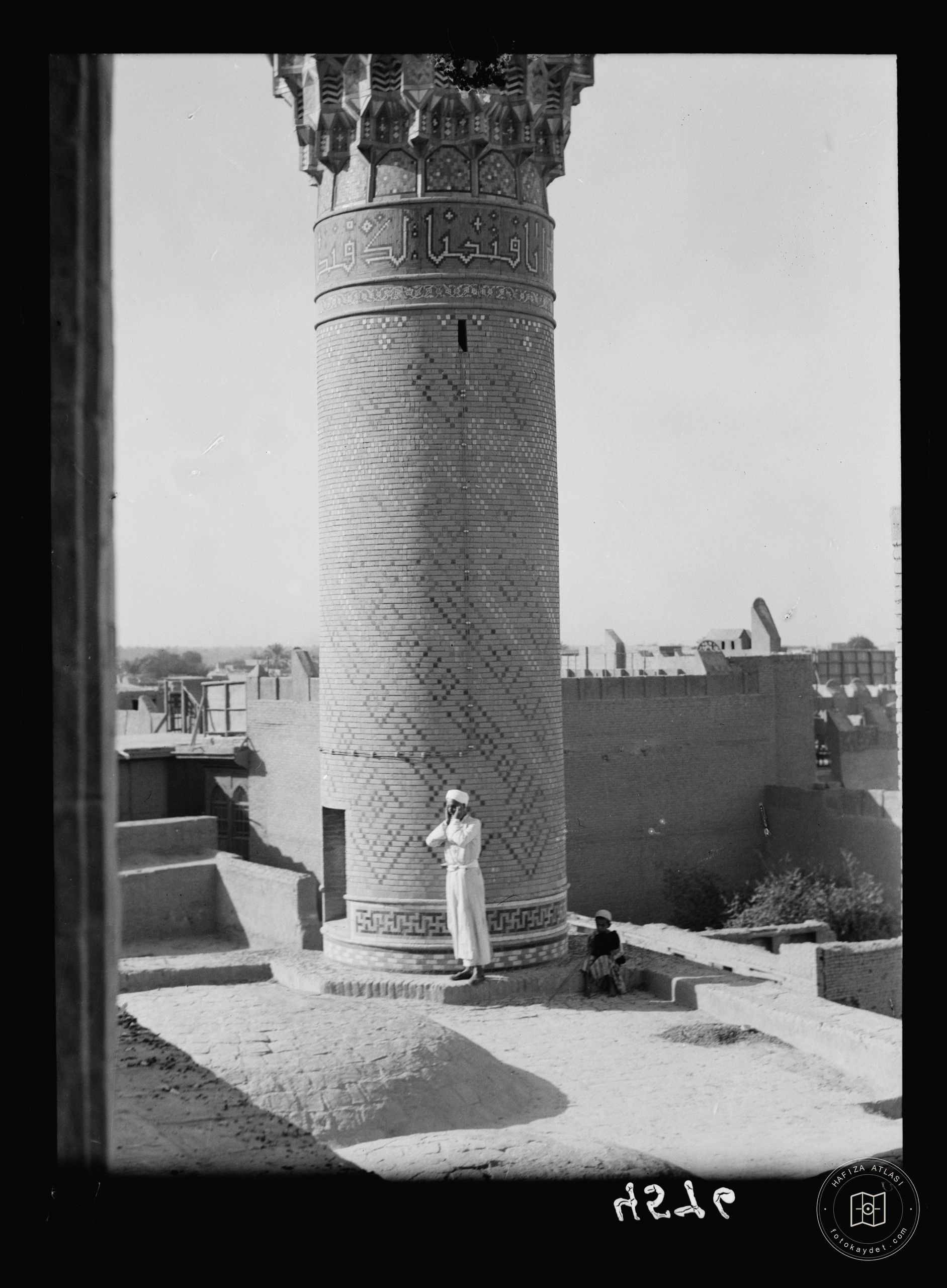 Baghdad. Lower section of the Haidar Khana Mosque. Muezzin calling to prayer