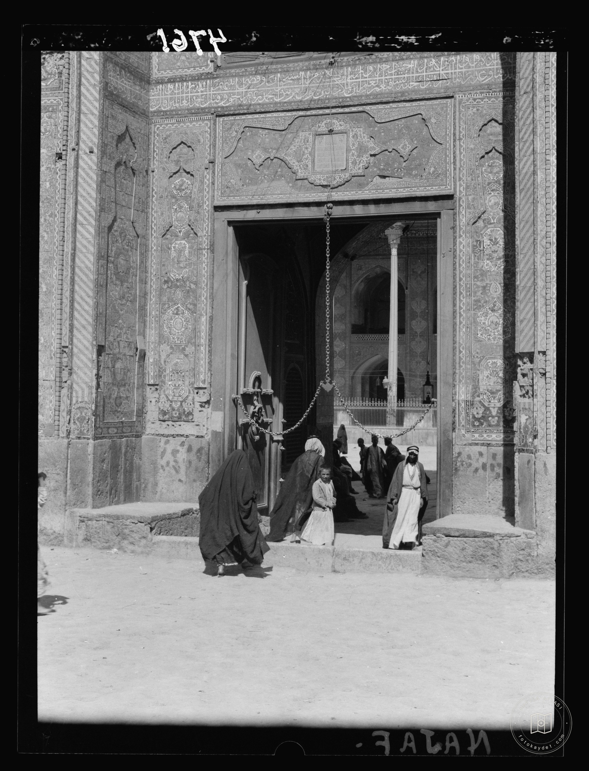 Nejaf. First sacred city of the Shiite Muslims. Mosque entrance. Lower section with beautiful blue tiling