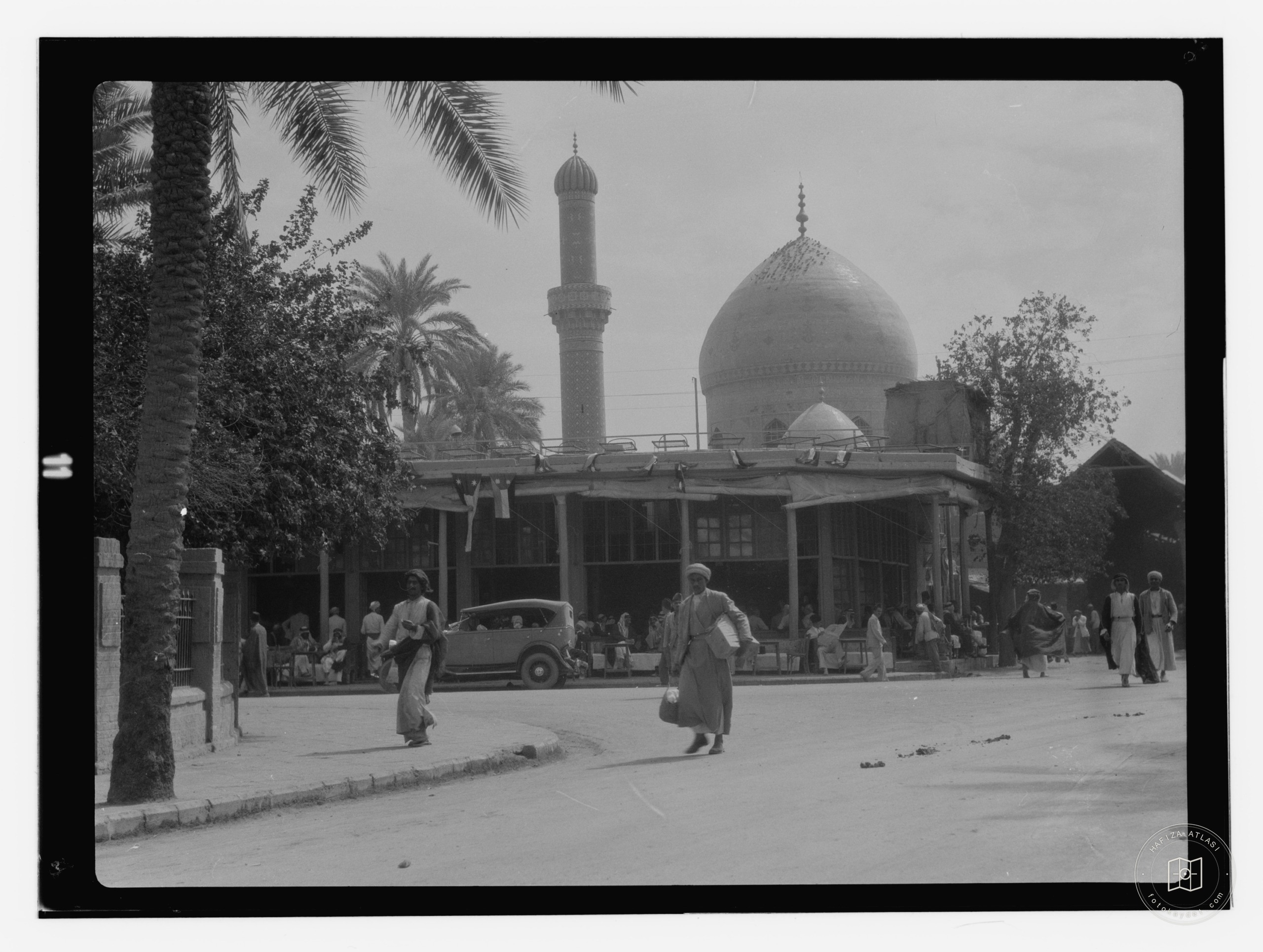 Baghdad. Street scene with Midan mosque in distance