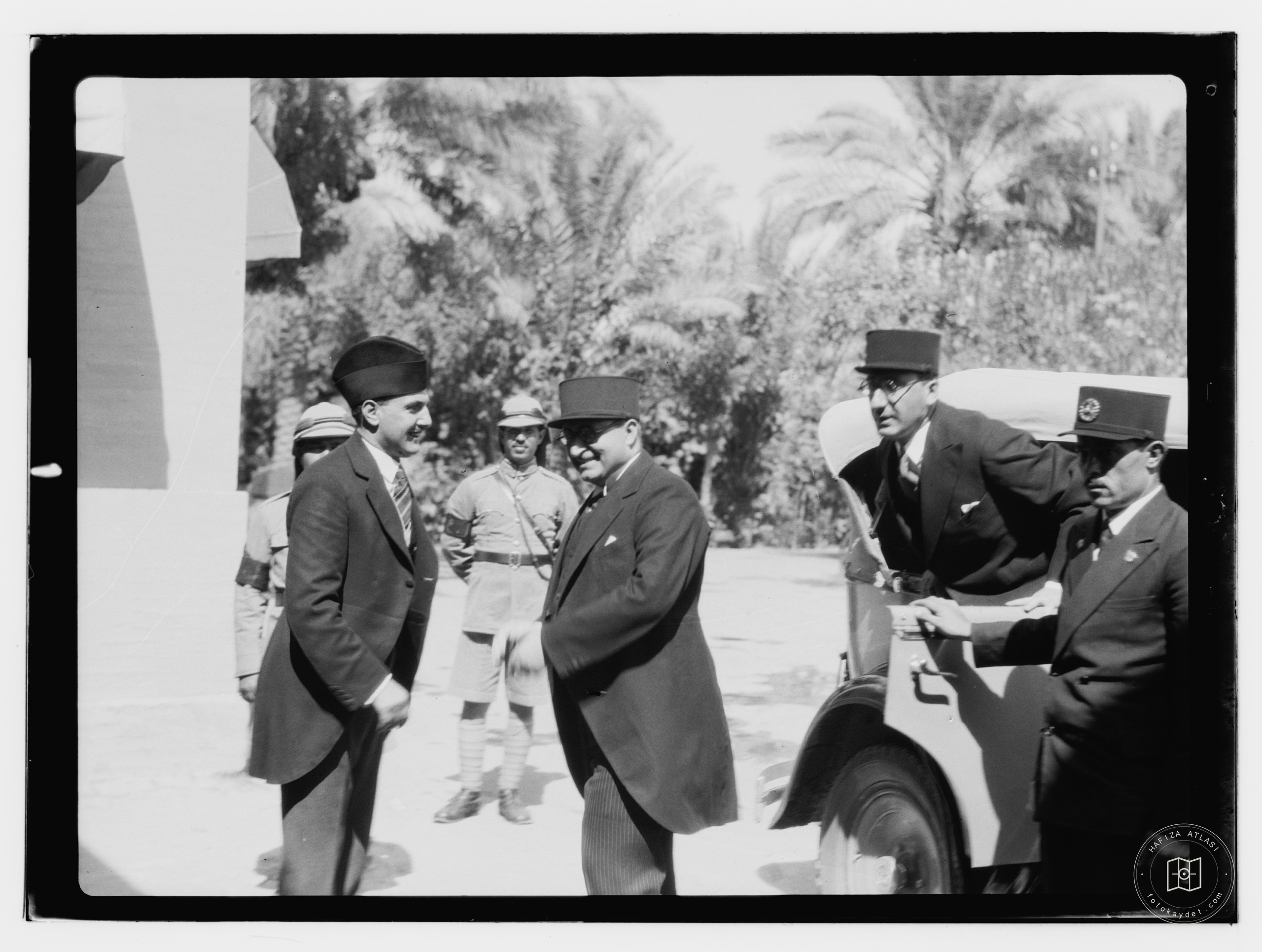 10/6/32 at the palace etc., Baghdad, French shaking hands