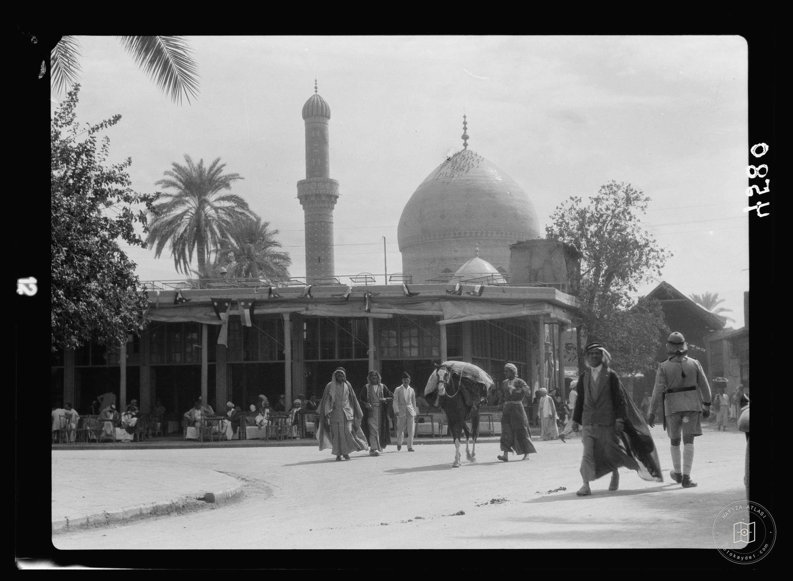 Baghdad. Street scene with Midan mosque in distance