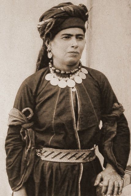 Iraq — Kurdish woman in traditional dress and jewelry