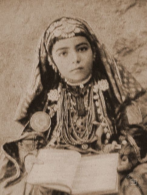 Iraq — Child in wedding attire, identified as a Chaldean bride