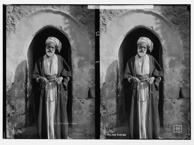 Village sheikh holding prayer beads