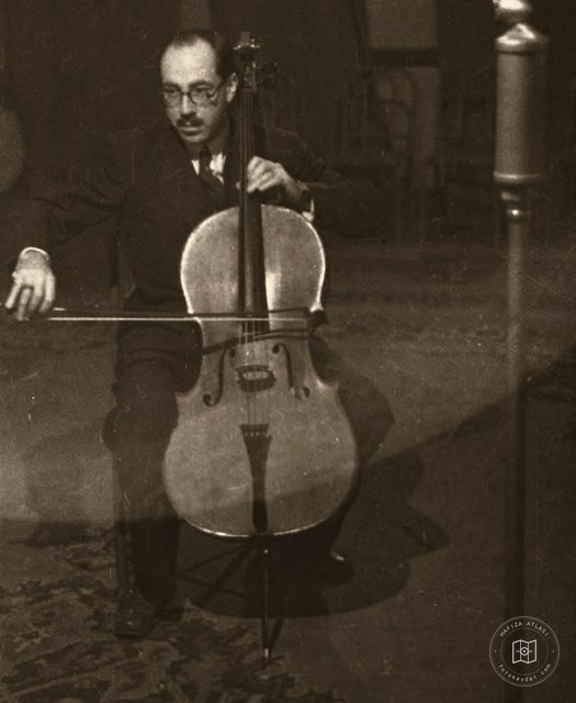 Mesut Cemil playing cello on stage