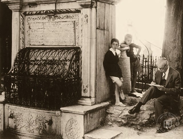 A. Süheyl Ünver taking notes beside children