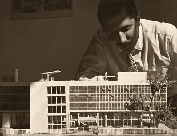 Turgut Cansever examining an architectural model