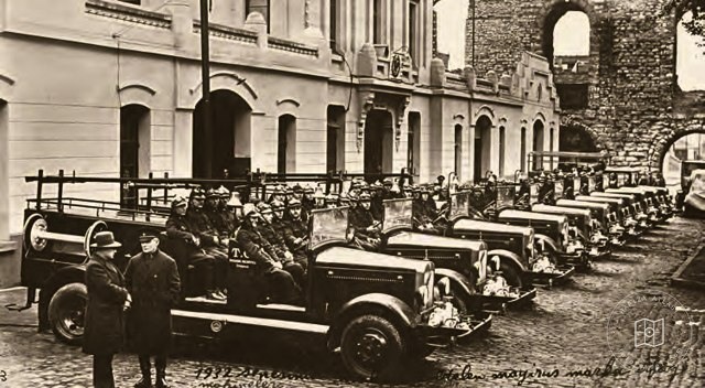 Firefighters and equipment ready outside the fire station, 1932