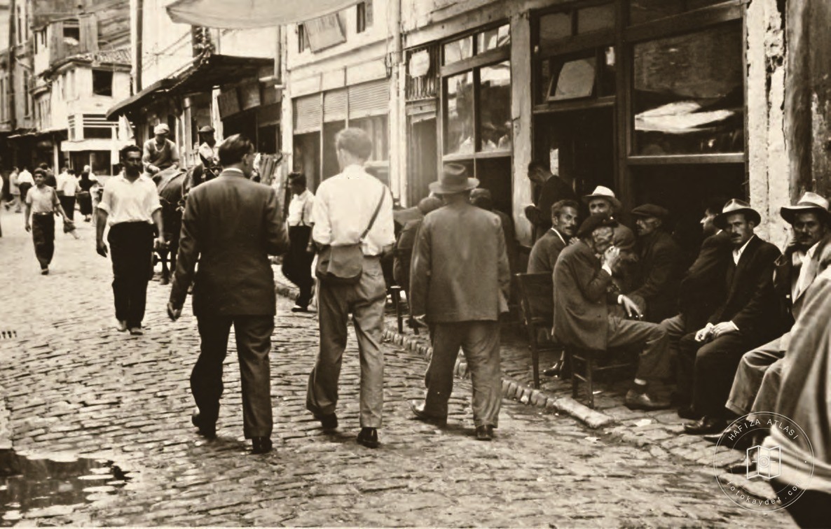 People passing time outside a coffeehouse on an Istanbul street