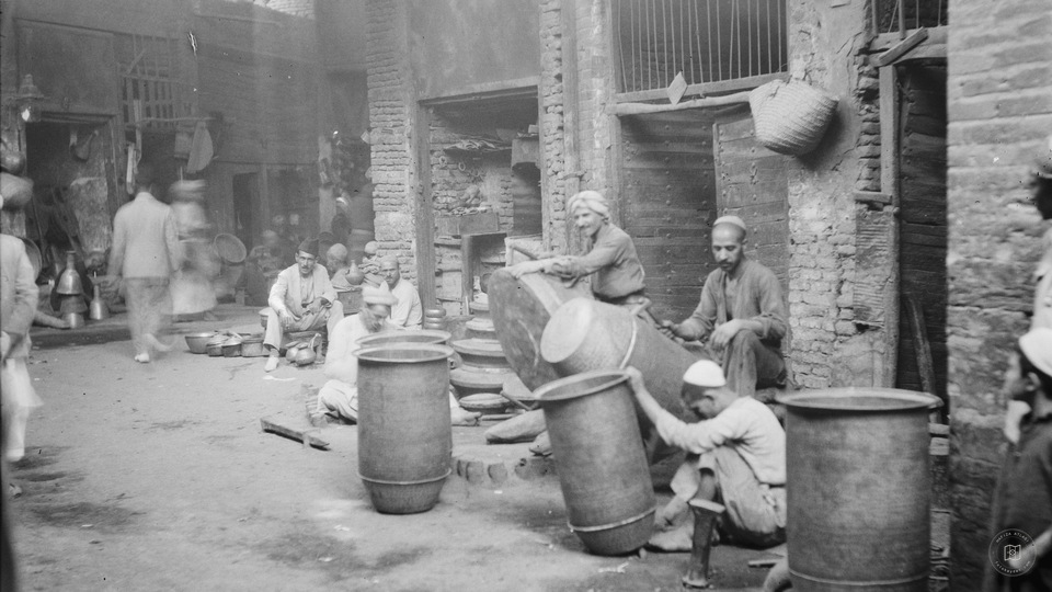 Baghdad. Copper workers. Hammering out large copper utensils