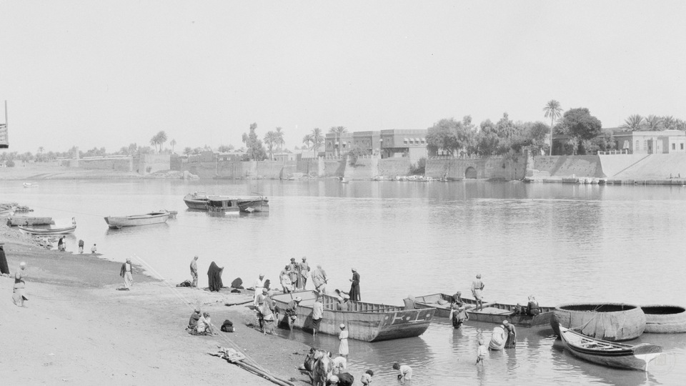 river scene & wall of city