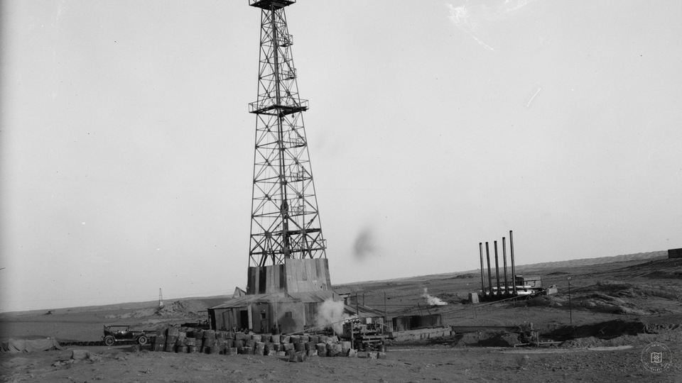Oil wells and camp of the Iraq Petroleum Company. (5 miles S. of Kirkuk). Kirkuk District. An oil driller. Showing full height of drill tower